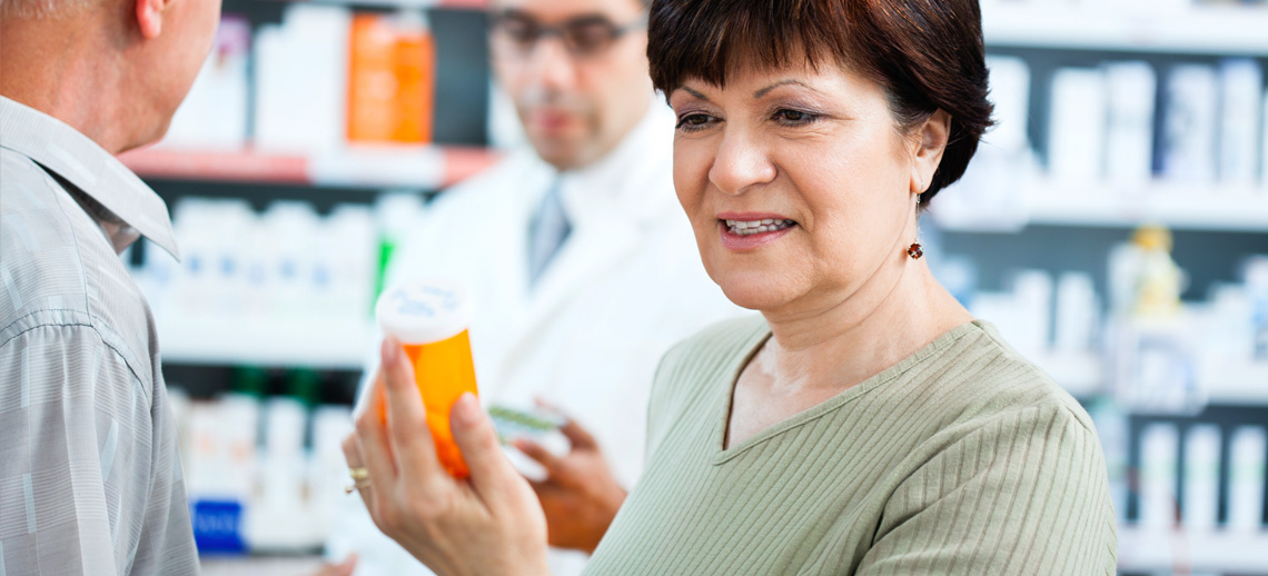 Woman reviewing her prescription bottle
